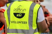 10 July 2022; parkrun Ireland, in partnership with Vhi, expanded their range of junior events to 30 with the introduction of the St Fergal’s Junior parkrun in Rathdowney, Laois on Sunday morning. Junior parkruns are 2km long and cater for 4 to 14-year olds, free of charge providing a fun and safe environment for children to enjoy exercise. To register for a parkrun near you visit www.parkrun.ie. Pictured is a parkrun volunteer branding during a parkrun in Rathdowney, Laois. Photo by Michael P Ryan/Sportsfile