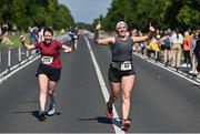10 July 2022; Eimear O'Connor of Le Chéile AC, Kildare, right, and Jennifer Connolly celebrate finishing the Irish Runner 10 Mile, Sponsored by Sports Travel International, incorporating the AAI National 10 Mile Road Race Championships at the Phoenix Park in Dublin. Photo by Sam Barnes/Sportsfile