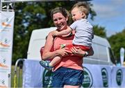 10 July 2022; Claire Lonergan, with her son Aaron, aged 2, from Firhouse in Dublin, celebrate finishing the Irish Runner 10 Mile, Sponsored by Sports Travel International, incorporating the AAI National 10 Mile Road Race Championships at the Phoenix Park in Dublin. Photo by Sam Barnes/Sportsfile