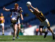 10 July 2022; Tiernan Mathers of New York shoots under pressure from Graham O'Sullivan of Kilkenny during the GAA Football All-Ireland Junior Championship Final match between Kilkenny and New York at Croke Park in Dublin. Photo by Piaras Ó Mídheach/Sportsfile