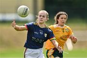 10 July 2022; Sara Doyle of Carlow in action against Saoirse Tennyson of Antrim during the TG4 All-Ireland Ladies Football Junior Championship Semi-Final match between Antrim and Carlow at Lann Léire GAA club in Dunleer, Louth. Photo by Oliver McVeigh/Sportsfile