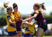 10 July 2022; Jenny Higgins of Roscommon is tackled by Sherene Hamiliton of Wexford during the TG4 All-Ireland Ladies Football Intermediate Championship Semi-Final match between Roscommon and Wexford at Crettyard GAA club, Crettyard, Laois. Photo by Michael P Ryan/Sportsfile