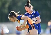 10 July 2022; Siofra Ní Chonaill of Clare in action against Erone Fitzpatrick of Laois during the TG4 All-Ireland Ladies Football Intermediate Championship Semi-Final match between Clare and Laois at St Brigid’s GAA club in Kiltoom, Roscommon. Photo by Brendan Moran/Sportsfile