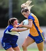 10 July 2022; Chloe Moloney of Clare in action against Clodagh Dunne of Laois during the TG4 All-Ireland Ladies Football Intermediate Championship Semi-Final match between Clare and Laois at St Brigid’s GAA club in Kiltoom, Roscommon. Photo by David Fitzgerald/Sportsfile