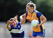 10 July 2022; Chloe Moloney of Clare in action against Clodagh Dunne of Laois during the TG4 All-Ireland Ladies Football Intermediate Championship Semi-Final match between Clare and Laois at St Brigid’s GAA club in Kiltoom, Roscommon. Photo by David Fitzgerald/Sportsfile
