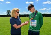 10 July 2022; Brid Golden, Vice President, Athletics Ireland and Fintan Dewhirst of Ireland with his silver medal from the 400m hurdles at the European Under-18 Athletic Championships in Israel during day three of the Irish Life Health National Juvenile Track and Field Championships at Tullamore Harriers Stadium in Tullamore, Offaly. Photo by Diarmuid Greene/Sportsfile