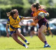 10 July 2022; Aisling Murphy of Wexford in action against Rachel Fitzmaurice of Roscommon during the TG4 All-Ireland Ladies Football Intermediate Championship Semi-Final match between Roscommon and Wexford at Crettyard GAA club, Crettyard, Laois. Photo by Michael P Ryan/Sportsfile