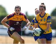 10 July 2022; Natalie McHugh of Roscommon in action against Aisling Halligan of Wexford during the TG4 All-Ireland Ladies Football Intermediate Championship Semi-Final match between Roscommon and Wexford at Crettyard GAA club, Crettyard, Laois. Photo by Michael P Ryan/Sportsfile