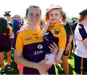 10 July 2022; Ciara Banville of Wexford celebrates with Eva Barrett age 2 and a half, after the TG4 All-Ireland Ladies Football Intermediate Championship Semi-Final match between Roscommon and Wexford at Crettyard GAA club, Crettyard, Laois. Photo by Michael P Ryan/Sportsfile