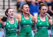 10 July 2022; Ireland players, from left, Roisin Upton, Deirdre Duke and Hannah McLoughlin sing the national anthem before the FIH Women's Hockey World Cup 9th/10th Place Play-off match between Ireland and South Africa at Wagener Stadium in Amstelveen, Netherlands. Photo by Jeroen Meuwsen/Sportsfile