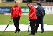 12 July 2022; Fourth umpire Jareth McCready, centre, inspects the pitch before the Men's One Day International match between Ireland and New Zealand at Malahide Cricket Club in Dublin. Photo by Harry Murphy/Sportsfile