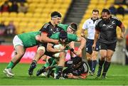 12 July 2022; Ryan Baird of Ireland is tackled by Marcel Renata and Caleb Delany of Maori All Blacks during the match between the Maori All Blacks and Ireland at the Sky Stadium in Wellington, New Zealand. Photo by Brendan Moran/Sportsfile