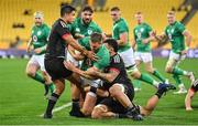 12 July 2022; Stuart McCloskey of Ireland is tackled by Josh Ioane, left, and Isaia Walker-Leawere of Maori All Blacks during the match between the Maori All Blacks and Ireland at the Sky Stadium in Wellington, New Zealand. Photo by Brendan Moran/Sportsfile
