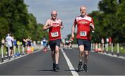 10 July 2022; Ron Hogan of LOVE2RUN AC, left, and Kevin McGale of LOVE2RUN AC, during the Irish Runner 10 Mile, Sponsored by Sports Travel International, incorporating the AAI National 10 Mile Road Race Championships at the Phoenix Park in Dublin. Photo by Sam Barnes/Sportsfile
