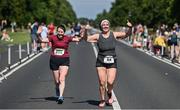 10 July 2022; Jennifer Connolly, left, and Eimear O'Connor of Le Chéile AC, Kildare, celebrate finishing the Irish Runner 10 Mile, Sponsored by Sports Travel International, incorporating the AAI National 10 Mile Road Race Championships at the Phoenix Park in Dublin. Photo by Sam Barnes/Sportsfile