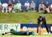 12 July 2022; Simi Singh of Ireland dives in despite the stump attempt by Mitchell Santner of New Zealand during the Men's One Day International match between Ireland and New Zealand at Malahide Cricket Club in Dublin. Photo by Harry Murphy/Sportsfile