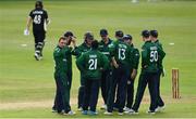 12 July 2022; Ireland players huddle as Tom Latham of New Zealand walks during the Men's One Day International match between Ireland and New Zealand at Malahide Cricket Club in Dublin. Photo by Harry Murphy/Sportsfile