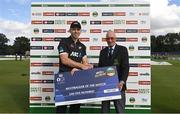 12 July 2022; Michael Bracewell of New Zealand is presented the Multibagger of the Match by Cricket Ireland president David Griffin during the Men's One Day International match between Ireland and New Zealand at Malahide Cricket Club in Dublin. Photo by Harry Murphy/Sportsfile