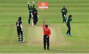 12 July 2022; Simi Singh of Ireland, right, celebrates the wicket of Tom Latham of New Zealand during the Men's One Day International match between Ireland and New Zealand at Malahide Cricket Club in Dublin. Photo by Harry Murphy/Sportsfile