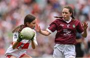 9 July 2022; Eva O'Donoghue, St Mary's N.S., Donnybrook, Dublin, representing Derry, in action against Megan Flanagan, Threen N.S., Trien, Castlerea, Roscommon, representing Galway, during the INTO Cumann na mBunscol GAA Respect Exhibition Go Games match during half-time of the GAA Football All-Ireland Senior Championship Semi-Final match between Galway and Derry at Croke Park in Dublin. Photo by Seb Daly/Sportsfile
