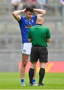 9 July 2022; Thomas Galligan of Cavan before being shown a red card by referee Barry Cassidy during the Tailteann Cup Final match between Cavan and Westmeath at Croke Park in Dublin. Photo by Seb Daly/Sportsfile