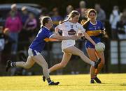 13 July 2022; Abaigh Cahill of Kildare is tackled by Ciara Redmond of Tipperary during the 2022 All-Ireland U16 B Final between Kildare and Tipperary at Crettyard, Co. Laois. Photo by Ray McManus/Sportsfile