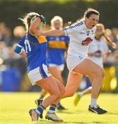 13 July 2022; Ciara O'Hora of Tipperaryis tackled by Beibhinn Hughes of Kildare during the 2022 All-Ireland U16 B Final between Kildare and Tipperary at Crettyard, Co. Laois. Photo by Ray McManus/Sportsfile