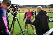 15 July 2022; James Lowe is interviewed by th emedia after the Ireland rugby captain's run at Sky Stadium in Wellington, New Zealand. Photo by Brendan Moran/Sportsfile
