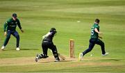 15 July 2022; Curtis Campher of Ireland attempts to run out Tom Latham of New Zealand during the Men's One Day International match between Ireland and New Zealand at Malahide Cricket Club in Dublin. Photo by Seb Daly/Sportsfile