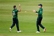 15 July 2022; Curtis Campher, left, and Harry Tector of Ireland celebrate taking the wicket of New Zealand's Tom Latham, bowled by Curtis Campher, caught by Harry Tector, during the Men's One Day International match between Ireland and New Zealand at Malahide Cricket Club in Dublin. Photo by Seb Daly/Sportsfile