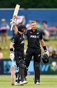 15 July 2022; Martin Guptill of New Zealand, right, celebrates after bringing up his century during the Men's One Day International match between Ireland and New Zealand at Malahide Cricket Club in Dublin. Photo by Seb Daly/Sportsfile