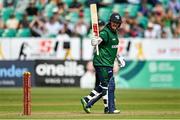 15 July 2022; Paul Stirling of Ireland acknowledges the crowd after bringing up his half-century during the Men's One Day International match between Ireland and New Zealand at Malahide Cricket Club in Dublin. Photo by Seb Daly/Sportsfile