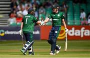 15 July 2022; Paul Stirling of Ireland, left, is congratulated by teammate Harry Tector after bringing up his half-century during the Men's One Day International match between Ireland and New Zealand at Malahide Cricket Club in Dublin. Photo by Seb Daly/Sportsfile