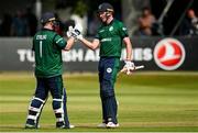 15 July 2022; Harry Tector of Ireland, right, is congratulated by teammate Paul Stirling after bringing up his half-century during the Men's One Day International match between Ireland and New Zealand at Malahide Cricket Club in Dublin. Photo by Seb Daly/Sportsfile