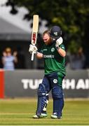 15 July 2022; Paul Stirling of Ireland acknowledges the crowd after bringing up his century during the Men's One Day International match between Ireland and New Zealand at Malahide Cricket Club in Dublin. Photo by Seb Daly/Sportsfile