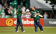 15 July 2022; Paul Stirling of Ireland, right, is congratulated by teammate Harry Tector after bringing up his century during the Men's One Day International match between Ireland and New Zealand at Malahide Cricket Club in Dublin. Photo by Seb Daly/Sportsfile