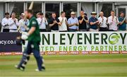 15 July 2022; Spectators applaud Ireland's Paul Stirling as he departs after being dismissed by Glenn Phillips of New Zealand during the Men's One Day International match between Ireland and New Zealand at Malahide Cricket Club in Dublin. Photo by Seb Daly/Sportsfile