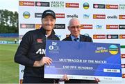15 July 2022; Martin Guptill of New Zealand is presented with his Multibagger of the Match cheque by Cricket Ireland president David Griffin after the Men's One Day International match between Ireland and New Zealand at Malahide Cricket Club in Dublin. Photo by Seb Daly/Sportsfile