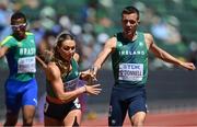 15 July 2022; Sophie Becker of Ireland, second from left,  takes the baton from team-mate Chris O'Donnell whilst competing in the mixed 4x400m relay heats during day one of the World Athletics Championships at Hayward Field in Eugene, Oregon, USA. Photo by Sam Barnes/Sportsfile
