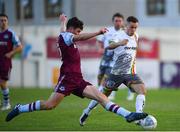 15 July 2022; Liam Burt of Bohemians is tackled by James Clarke of Drogheda United during the SSE Airtricity League Premier Division match between Drogheda United and Bohemians at Head in the Game Park in Drogheda, Co Louth. Photo by George Tewkesbury/Sportsfile