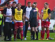 15 July 2022; Dundalk players, including injured Brian Gartland, centre, confront fourth official Neil Doyle following the sending off of Dundalk head coach Stephen O'Donnell after the SSE Airtricity League Premier Division match between St Patrick's Athletic and Dundalk at Richmond Park in Dublin. Photo by Ben McShane/Sportsfile