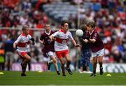 9 July 2022; George Morrison, Bunscoil Bhóthar na Naomh, Lismore, Port Láirge, representing Galway with Ruairí Smith, Killygarry N.S., Killygarry, Cavan, and  Fionn Rea, Primate Dixon Coalisland, Coalisland, Tyrone, representing Derry during the INTO Cumann na mBunscol GAA Respect Exhibition Go Games at half-time of the GAA Football All-Ireland Senior Championship Semi-Final match between Galway and Derry at Croke Park in Dublin. Photo by Ray McManus/Sportsfile