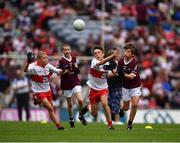 9 July 2022; George Morrison, Bunscoil Bhóthar na Naomh, Lismore, Port Láirge, representing Galway with Ruairí Smith, Killygarry N.S., Killygarry, Cavan, and  Fionn Rea, Primate Dixon Coalisland, Coalisland, Tyrone, representing Derry during the INTO Cumann na mBunscol GAA Respect Exhibition Go Games at half-time of the GAA Football All-Ireland Senior Championship Semi-Final match between Galway and Derry at Croke Park in Dublin. Photo by Ray McManus/Sportsfile