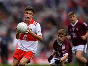 9 July 2022; Ruairí Smith, Killygarry N.S., Killygarry, Cavan, representing Derry and Jamie Burns, St Marys N.S., Kilrusheighter, Templeboy, Sligo, representing Galway during the INTO Cumann na mBunscol GAA Respect Exhibition Go Games at half-time of the GAA Football All-Ireland Senior Championship Semi-Final match between Galway and Derry at Croke Park in Dublin. Photo by Ray McManus/Sportsfile