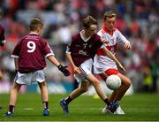 9 July 2022; Aaron Mullally, Murrintown N.S., Murrintown, Wexford, representing Galway and Fionn Brady, Scoil Mhuire, Magherarney, Smithborough, Monaghan, representing Derry during the INTO Cumann na mBunscol GAA Respect Exhibition Go Games at half-time of the GAA Football All-Ireland Senior Championship Semi-Final match between Galway and Derry at Croke Park in Dublin. Photo by Stephen McCarthy/Sportsfile  Photo by Ray McManus/Sportsfile *** NO REPRODUCTION FEE ***