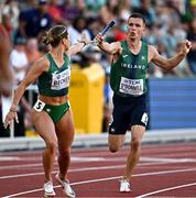 15 July 2022; Chris O'Donnell of Ireland passes the baton to teammate Sophie Becker in the 4x400m mixed relay final during day one of the World Athletics Championships at Hayward Field in Eugene, Oregon, USA. Photo by Sam Barnes/Sportsfile