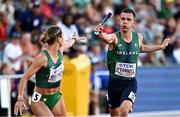 15 July 2022; Chris O'Donnell of Ireland passes the baton to teammate Sophie Becker in the 4x400m mixed relay final during day one of the World Athletics Championships at Hayward Field in Eugene, Oregon, USA. Photo by Sam Barnes/Sportsfile