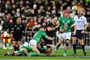 16 July 2022; Sam Cane of New Zealand is tackled by Jonathan Sexton of Ireland during the Steinlager Series match between the New Zealand and Ireland at Sky Stadium in Wellington, New Zealand.