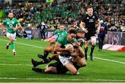16 July 2022; Hugo Keenan of Ireland on his way to scoring his side's second try despite the tackle of Aaron Smith of New Zealand during the Steinlager Series match between the New Zealand and Ireland at Sky Stadium in Wellington, New Zealand. Photo by Brendan Moran/Sportsfile