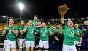 16 July 2022; James Lowe of Ireland celebrates with the trophy and teammates after their side's victory in the Steinlager Series match between the New Zealand and Ireland at Sky Stadium in Wellington, New Zealand. Photo by Brendan Moran/Sportsfile